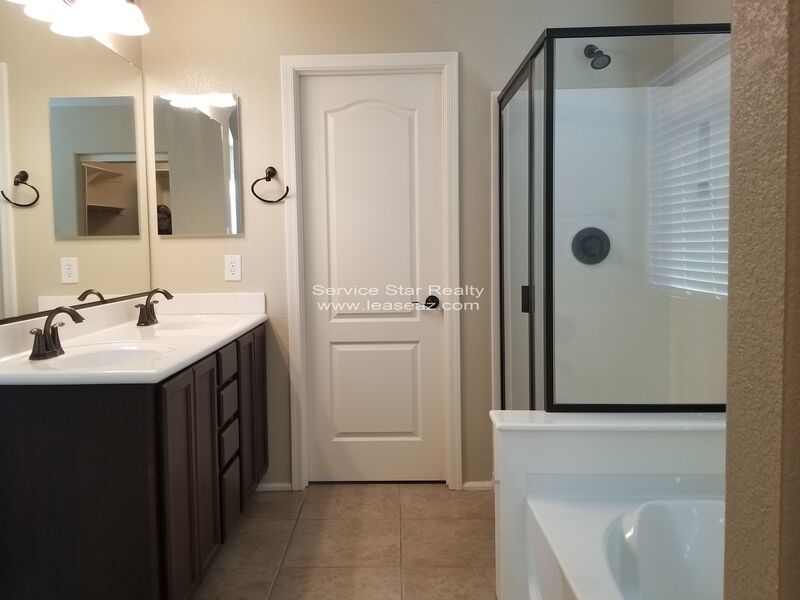 GORGEOUS POWER RANCH 4 BEDROOM WITH GRASS NEXT TO COMMUNITY PARK property image